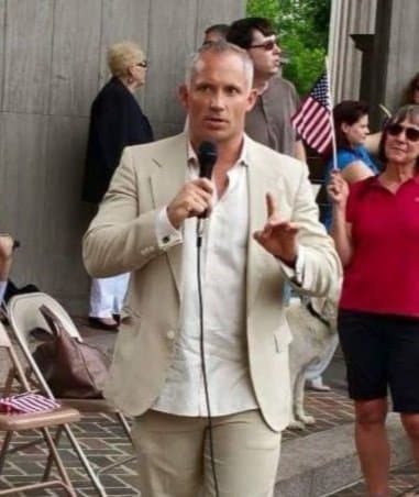 Corey Wiegand, Chief Financial Officer of CIAP, speaking at a community event